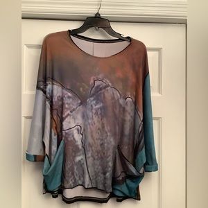 Ladies top with dolman cuffed sleeves and front pockets. NWT. Size XS/S.